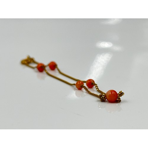 1130 - Two pieces of 9ct gold jewellery, one coral beaded bracelet and one pendant - approx. gross weight 2... 