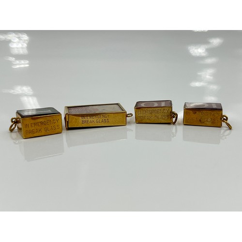 1143 - Four 9ct gold cased emergency money charms - approx. gross weight 10.71 grams