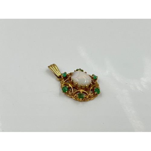 1144 - A hallmarked London 9ct opal and emerald pendant, dated 1973 - approx gross weight 2.28 grams