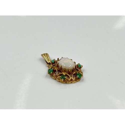 1144 - A hallmarked London 9ct opal and emerald pendant, dated 1973 - approx gross weight 2.28 grams