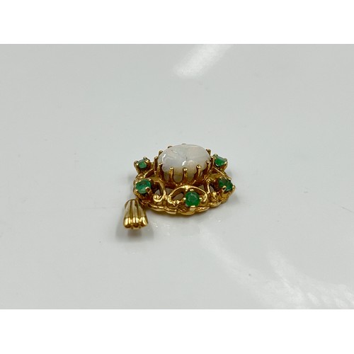 1144 - A hallmarked London 9ct opal and emerald pendant, dated 1973 - approx gross weight 2.28 grams