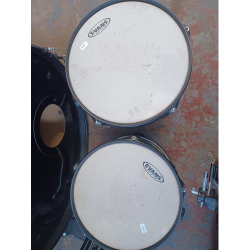 558 - A Stagg five piece drum kit, comprising snare fitted with Remo heads, toms fitted with Evans batters... 