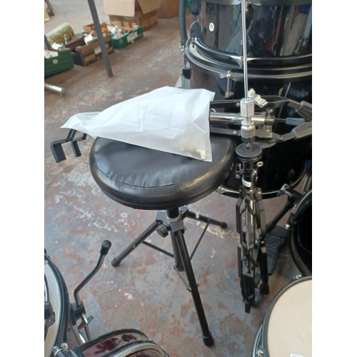 558 - A Stagg five piece drum kit, comprising snare fitted with Remo heads, toms fitted with Evans batters... 