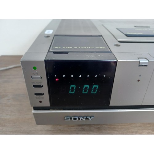 522 - Two items, one Sony SL-C5UB Betamax video recorder and one video cassette storage unit