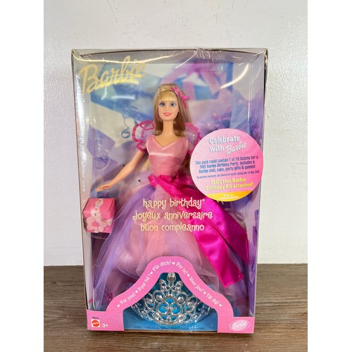 331 - Four boxed Barbie dolls