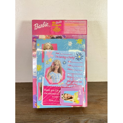 331 - Four boxed Barbie dolls