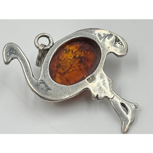 1094 - Eight pieces of .925 silver amber jewellery to include brooches, pendants etc. - approx. gross weigh... 