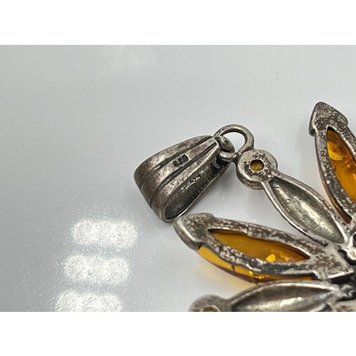 1094 - Eight pieces of .925 silver amber jewellery to include brooches, pendants etc. - approx. gross weigh... 