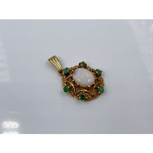 1144 - A hallmarked London 9ct opal and emerald pendant, dated 1973 - approx gross weight 2.28 grams