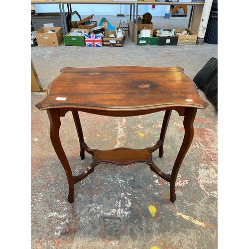 139A - An Edwardian mahogany serpentine two tier side table