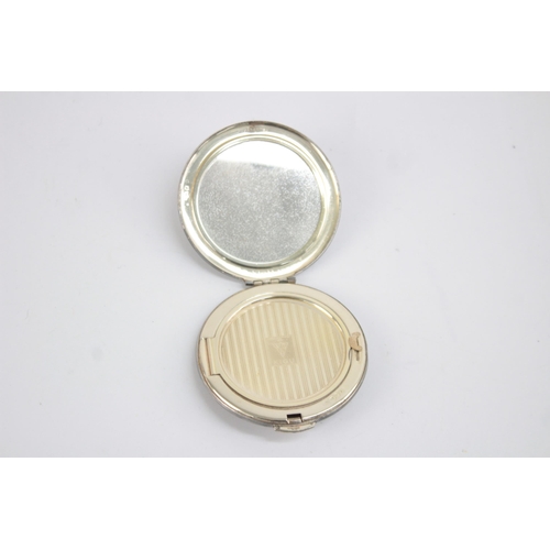 1211 - A Kigu hallmarked London silver vanity compact, dated 1963 - approx. gross weight 71 grams and 7cm d... 