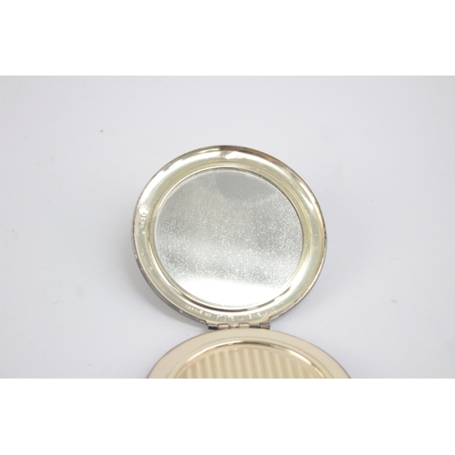 1211 - A Kigu hallmarked London silver vanity compact, dated 1963 - approx. gross weight 71 grams and 7cm d... 