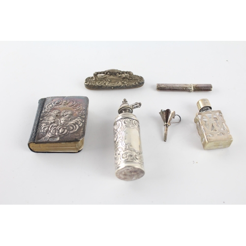 1212 - Six hallmarked sterling silver items to include scent bottles, needle case, silver fronted Bible etc... 