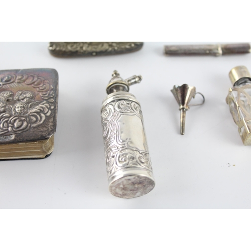 1212 - Six hallmarked sterling silver items to include scent bottles, needle case, silver fronted Bible etc... 