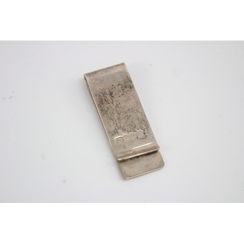 1227 - A hallmarked Edinburgh silver money clip, dated 1996 - approx. gross weight 20 grams and 6cm long