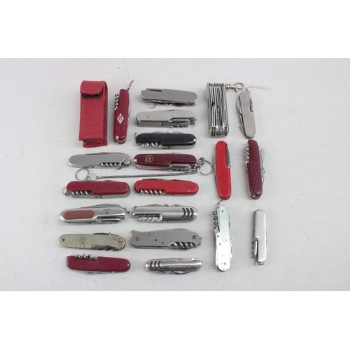 1248 - Twenty Swiss Army style pocket knives and tools