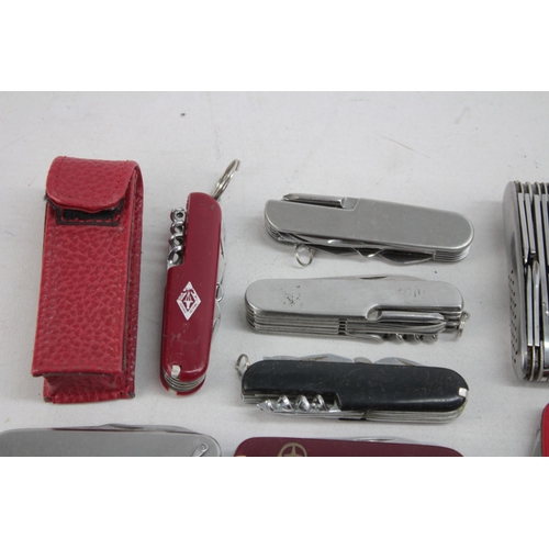 1248 - Twenty Swiss Army style pocket knives and tools