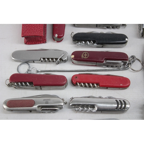 1248 - Twenty Swiss Army style pocket knives and tools