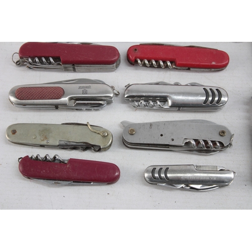 1248 - Twenty Swiss Army style pocket knives and tools