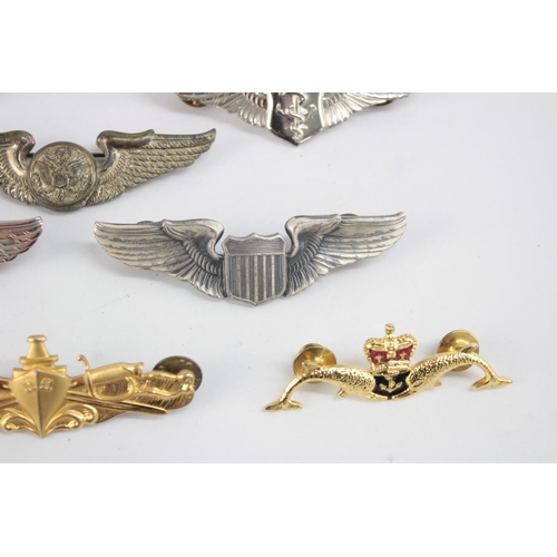 1252 - Ten military badges to include American, Air Force etc.