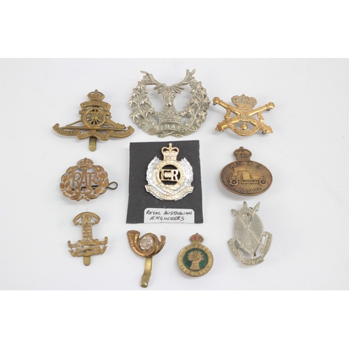 1262 - Ten military cap badges to include Women's Land Army, R.N.A.S etc.