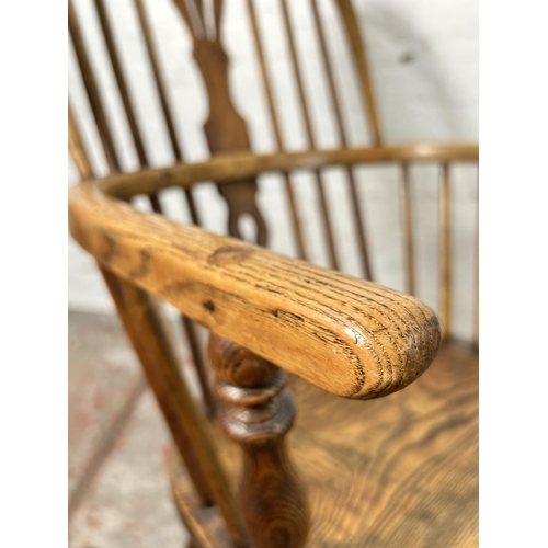 1 - A 19th century elm Windsor armchair - approx. 102cm high x 55cm wide x 41cm deep