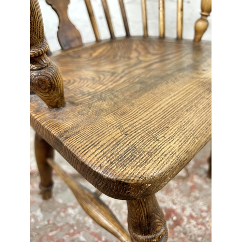 1 - A 19th century elm Windsor armchair - approx. 102cm high x 55cm wide x 41cm deep