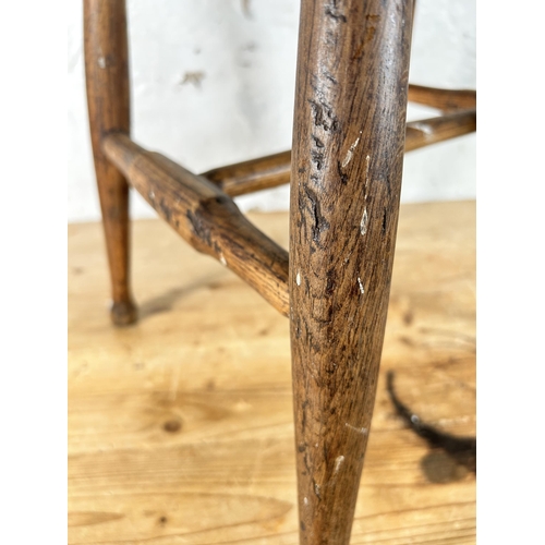 11 - A 19th century elm farmhouse stool - approx. 46cm high x 35cm wide x 28cm deep