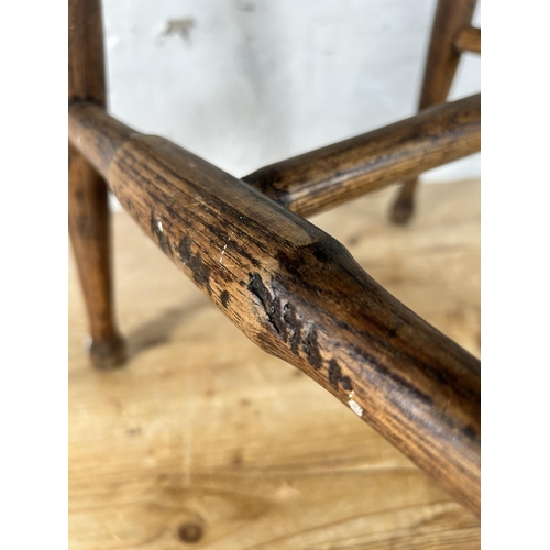 11 - A 19th century elm farmhouse stool - approx. 46cm high x 35cm wide x 28cm deep