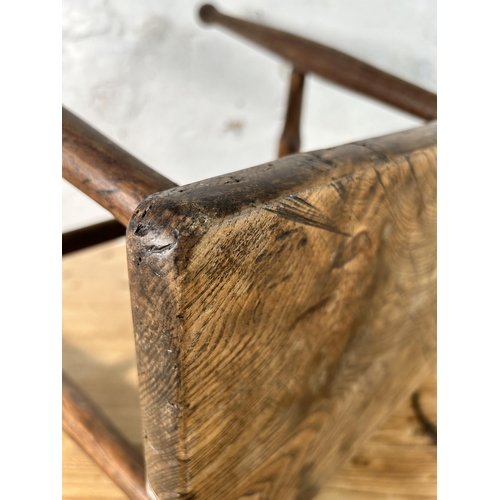 11 - A 19th century elm farmhouse stool - approx. 46cm high x 35cm wide x 28cm deep