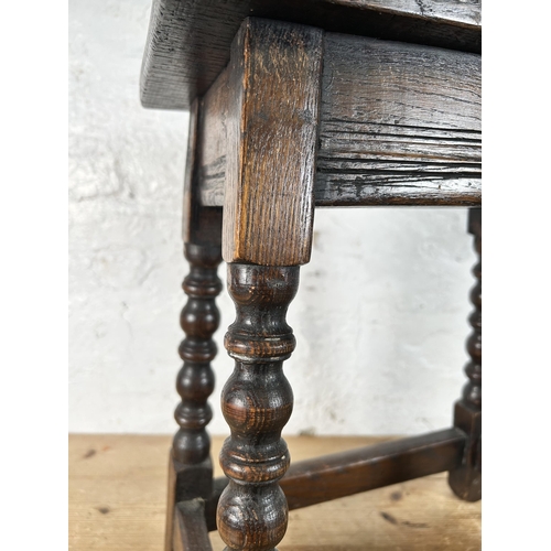 12 - A 17th century style oak joint stool with turned supports - approx. 45cm high x 39cm wide x 23cm dee... 