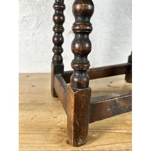 12 - A 17th century style oak joint stool with turned supports - approx. 45cm high x 39cm wide x 23cm dee... 