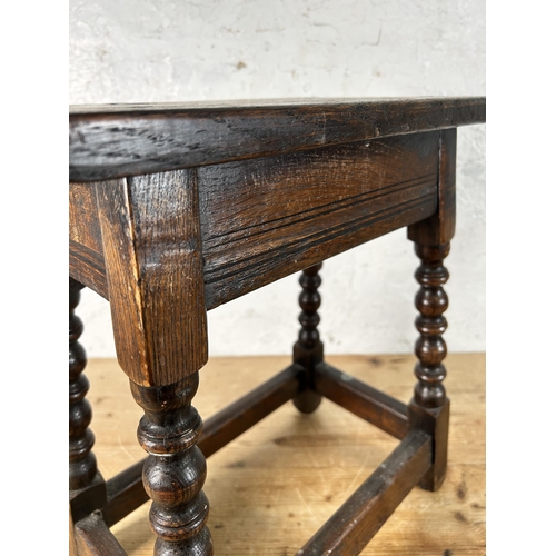 12 - A 17th century style oak joint stool with turned supports - approx. 45cm high x 39cm wide x 23cm dee... 