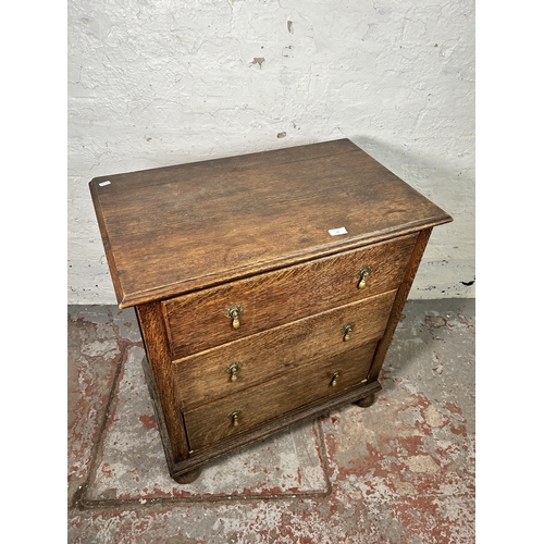 13 - An early 20th century oak chest of three drawers - approx. 82cm high x 75cm wide x 45cm deep