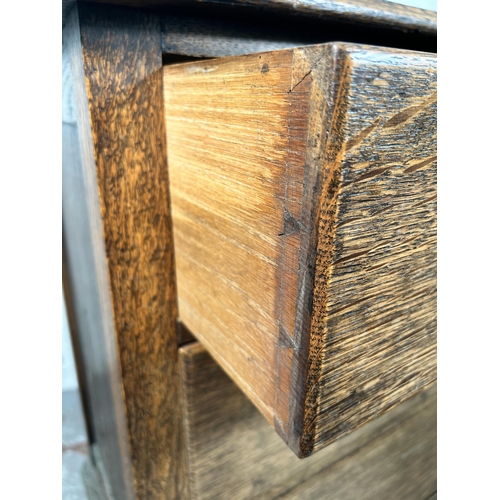 13 - An early 20th century oak chest of three drawers - approx. 82cm high x 75cm wide x 45cm deep