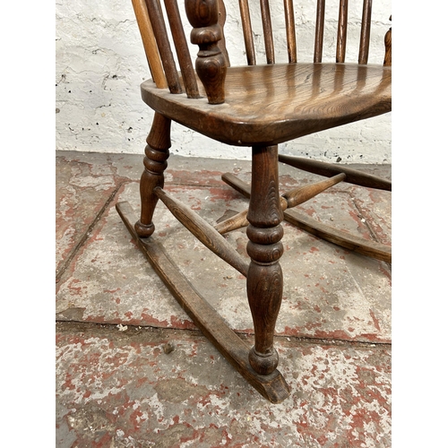 2 - A 19th century elm Windsor rocking chair - approx. 100cm high x 50cm wide x 38cm deep