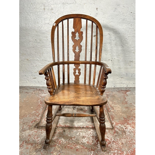 2 - A 19th century elm Windsor rocking chair - approx. 100cm high x 50cm wide x 38cm deep