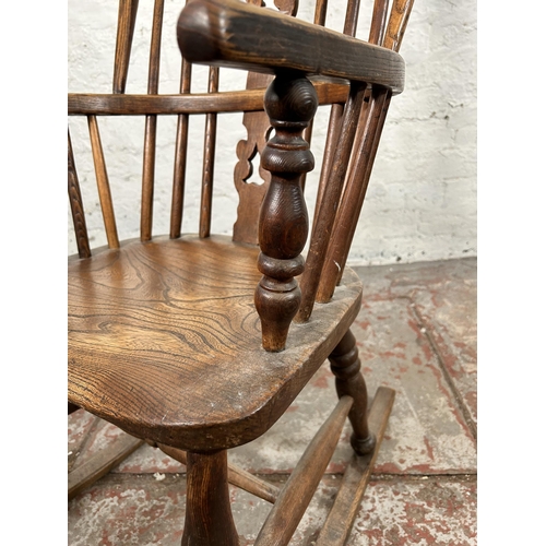 2 - A 19th century elm Windsor rocking chair - approx. 100cm high x 50cm wide x 38cm deep