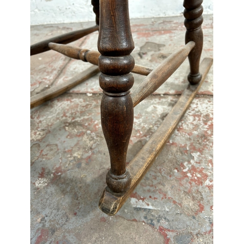 2 - A 19th century elm Windsor rocking chair - approx. 100cm high x 50cm wide x 38cm deep