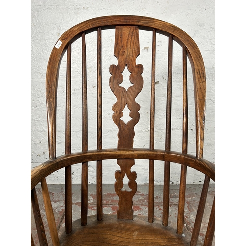 2 - A 19th century elm Windsor rocking chair - approx. 100cm high x 50cm wide x 38cm deep