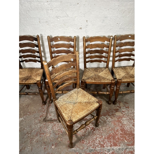 20 - Five 19th century style elm Lancashire dining chairs with rush seats