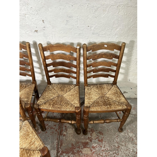 20 - Five 19th century style elm Lancashire dining chairs with rush seats