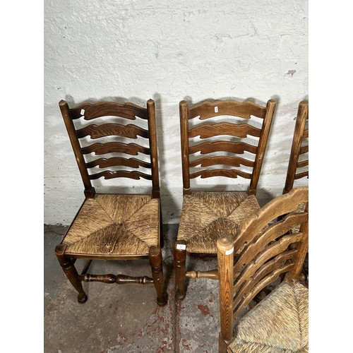 20 - Five 19th century style elm Lancashire dining chairs with rush seats