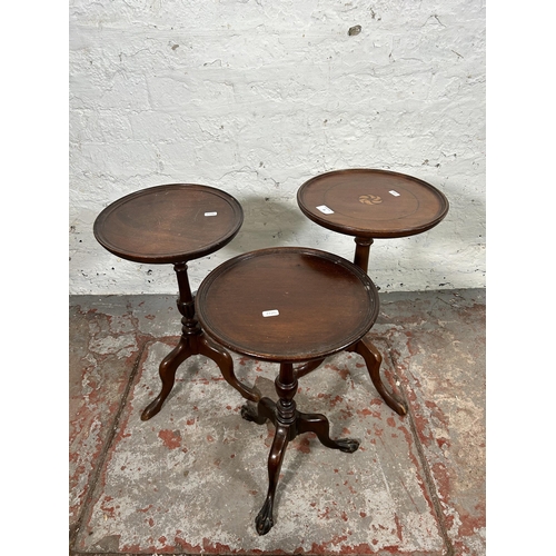 21 - Three mahogany circular tripod pedestal wine tables - largest approx. 54cm high x 31cm diameter