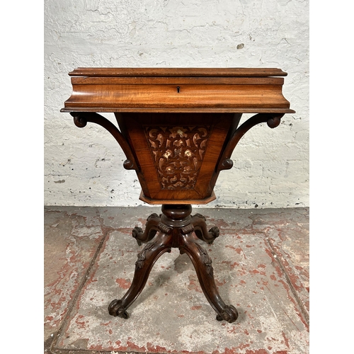 23 - A Victorian carved walnut sewing table on quatrefoil base - approx. 72cm high x 51cm wide x 40cm dee... 