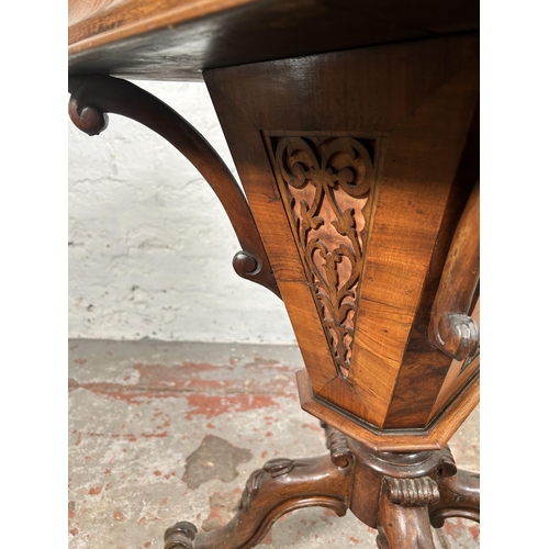 23 - A Victorian carved walnut sewing table on quatrefoil base - approx. 72cm high x 51cm wide x 40cm dee... 