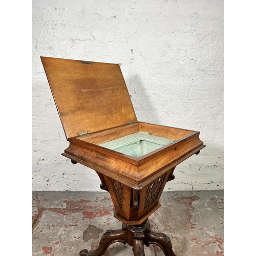 23 - A Victorian carved walnut sewing table on quatrefoil base - approx. 72cm high x 51cm wide x 40cm dee... 