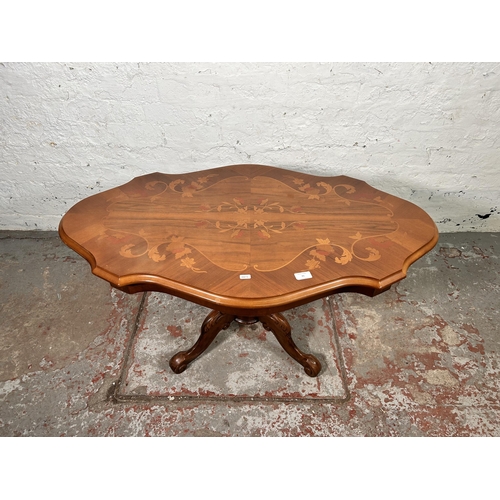 25 - An Italian style inlaid walnut effect serpentine pedestal coffee table - approx. 53cm high x 62cm wi... 