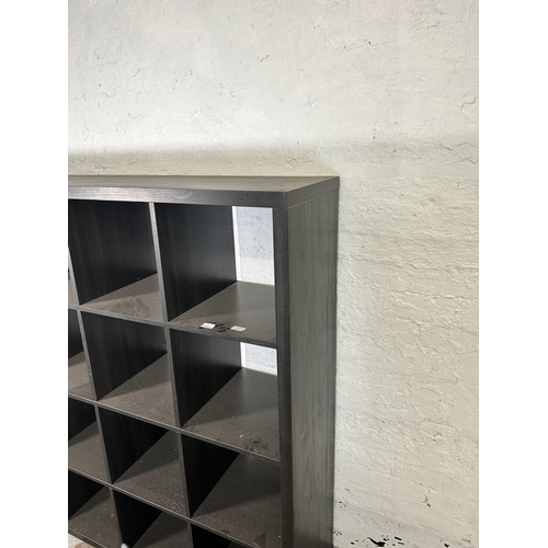 26 - A modern black ash effect sixteen cube shelving unit - approx. 147cm high x 147cm wide x 39cm deep a... 