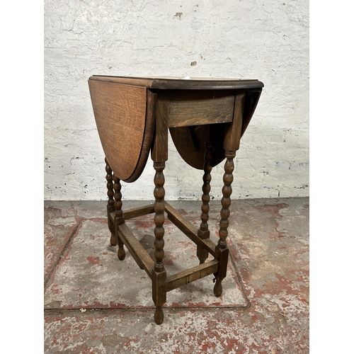 3 - An oak drop leaf gate leg oval occasional table on bobbin turned supports - approx. 74cm high x 60cm... 